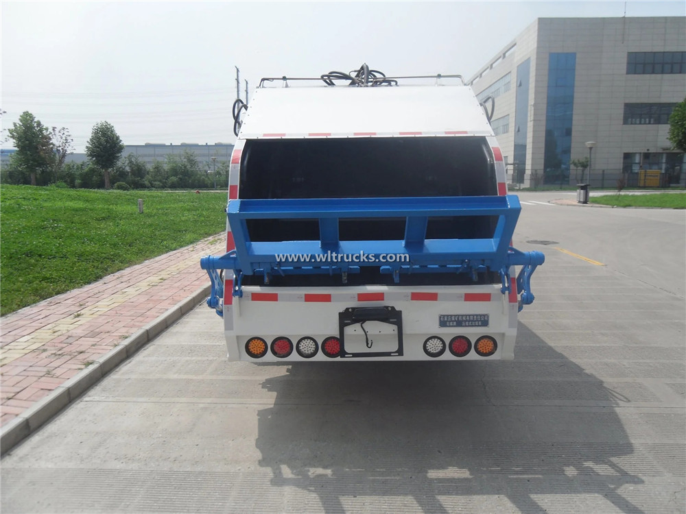 Rear loading garbage compactor truck