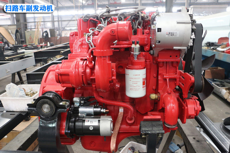 Road sweeper auxiliary engine