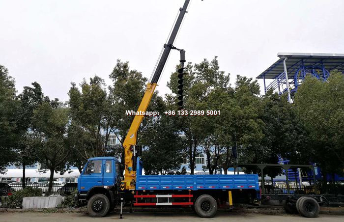Truck mounted crane with drilling machine