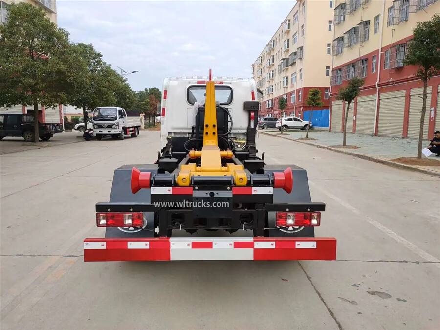 China FAW 5000-6000 liters hook arm garbage truck